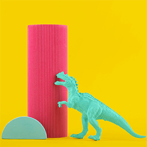 A funny desk accessory, such as a stapler shaped like a dinosaur or a pen holder shaped like a toilet.