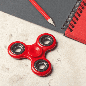 A desk toy, such as a fidget spinner or stress ball.